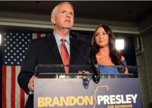 Democratic gubernatorial challenger Brandon Presley, with wife Katelyn by his side, concedes the race for governor before his supporters at his watch party held at the Faulkner Hotel in Jackson, Tuesday, Nov. 7, 2023.