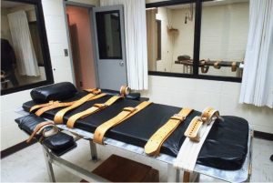 ** FILE ** Two-way mirrored windows look in at the lethal injection room at the Mississippi State Penitentiary in Parchman, Miss., shown in this July 12, 2002, file photograp Credit: Photo/Rogelio Solis, File)