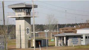 In this March 20, 2019, photo, a watch tower stands high on the grounds of the Central Mississippi Correctional Facility in Pearl, Miss. (AP Photo/Rogelio V. Solis)
