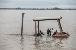 Farm equipment is nearly submerged in flood water in north Issaquena County, Miss., Friday, April 5, 2019.