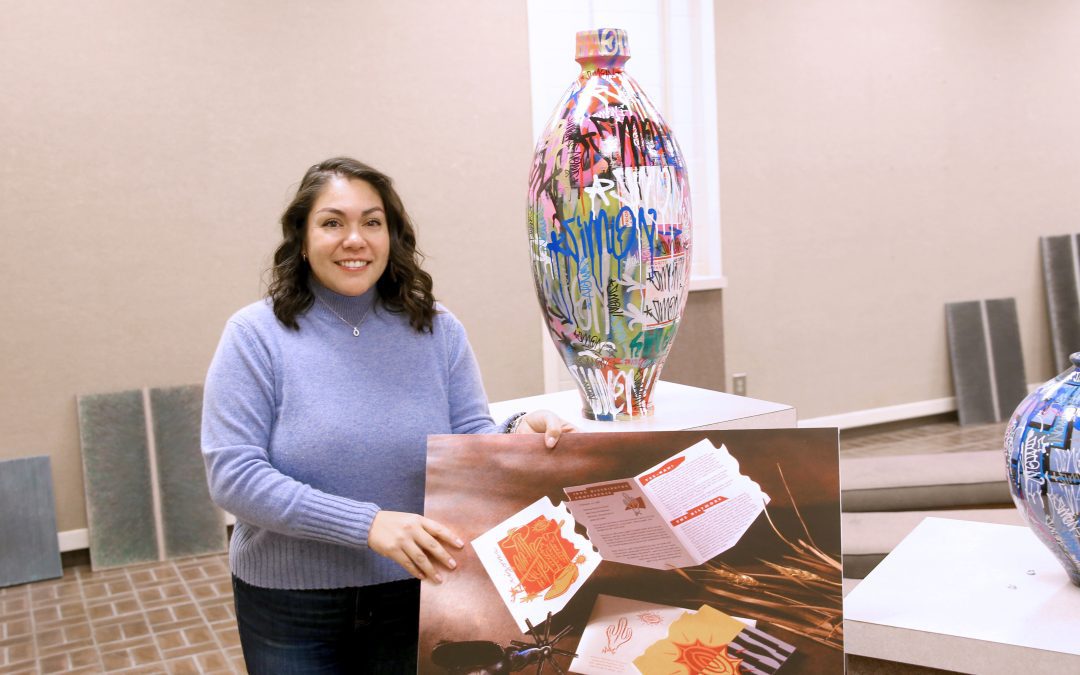 LeeReyna Lopez Leyva, Director of the Marie Hull Art Gallery at Hinds Community College's Raymond Campus, prepares for the newest art exhibit showing through Feb. 8. The show features works from the art faculty of the Mississippi University for Women.