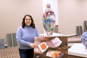LeeReyna Lopez Leyva, Director of the Marie Hull Art Gallery at Hinds Community College's Raymond Campus, prepares for the newest art exhibit showing through Feb. 8. The show features works from the art faculty of the Mississippi University for Women.