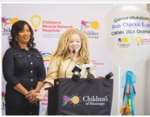 Ava Clarke Edney, with her mom, Shala Edney, by her side, speaks during her announcement as the state's 2024 Children's Miracle Network Hospitals Champion.