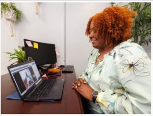 Erica Taylor-Wilson participates in her son's telehealth visit.