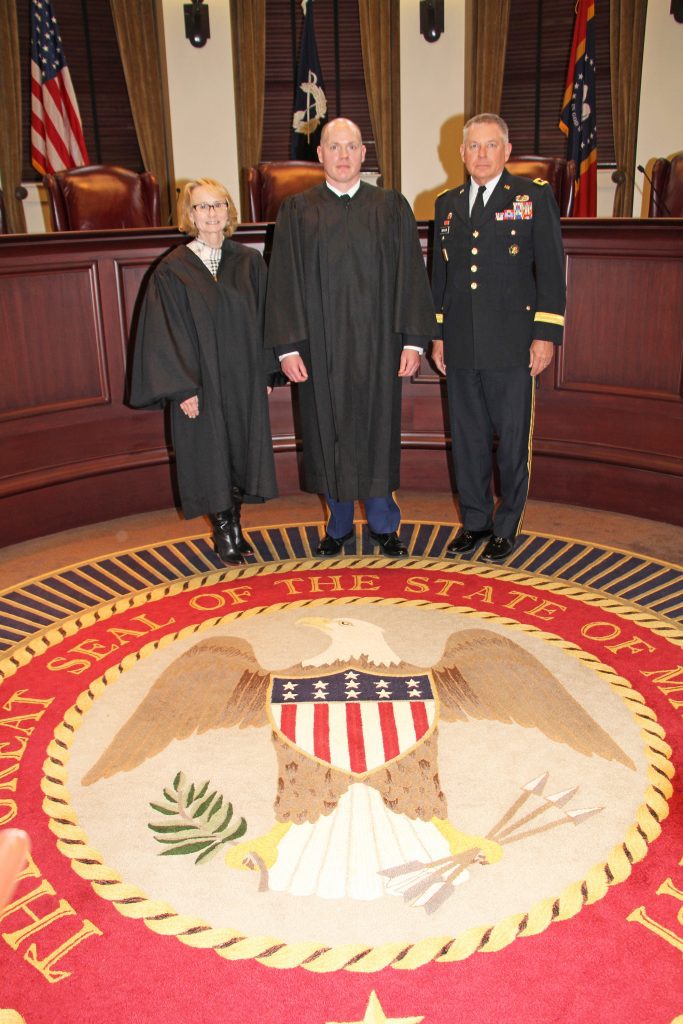 Left to right, Mississippi Court of Appeals Presiding Judge Virginia Carlton, Col. Nick Saucier and Maj. Gen. Janson Boyles, Adjutant General of the Mississippi National Guard, stand for a photo after Col. Saucier’s Promotion and Investiture Ceremony on March 1 in Jackson.