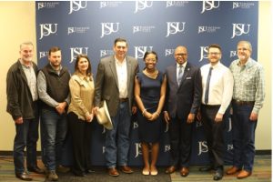  Commissioner of Agriculture and Commerce Andy Gipson announced a promotional partnership between the Mississippi Department of Agriculture and Commerce and Jackson State University. Pictured L-R: Gene Robertson, Interim Director of the State Metrology Laboratory; Clay Hammons, Director of Petroleum Products Inspection; Jennifer Thompson, Director of the Bureau of Regulatory Services; Commissioner Andy Gipson; Morgan Graves, JSU’s SGA Vice President; JSU President Marcus Thompson, Ph.D.; Henri Fuselier, Director of Consumer Protection; and Brent Bowman, Director of Weights & Measures.