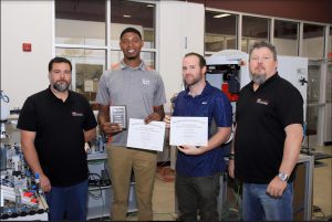 From left, Hinds Community College Mechatronics Technology Instructor David Roberts, students Ryshun Watts of Ridgeland, John Toney of Mendenhall and Hinds Industrial Maintenance Technology Instructor Glenn Teele. Watts and Toney served apprenticeships at Johns Manville in Richland. Watts was named Outstanding Student at Hinds