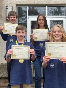 Eighth Grade Winners: Back row: (l. to r.) Skylar Balch (1st place, Pass Christian Middle School); Brooklyn Guymon (2nd place, St Patrick Catholic High School) Seventh Grade Winners: Front row: (l. to r.) Sebastian Slaydon (1st place, Biloxi Junior High School); Tucker Hoffman (2nd place, Pass Christian Middle School)