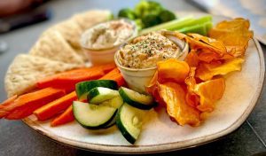Greek dip duo at Keg and Barrel in Hattiesburg is a delicious combination of hummus and feta dip, homemade pita bread and chips and crisp vegetables.
