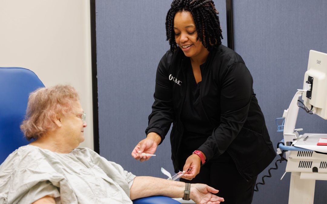 Registered Nurse Sheakitra Hodge attends to patient Judy Barnes at the Pain Management Clinic at the Jackson Medical Mall. "Everybody I've ever come in contact with at UMMC is wonderful and has a caring attitude," Barnes said. "It's impressive."