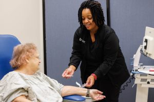 Registered Nurse Sheakitra Hodge attends to patient Judy Barnes at the Pain Management Clinic at the Jackson Medical Mall. "Everybody I've ever come in contact with at UMMC is wonderful and has a caring attitude," Barnes said. "It's impressive."