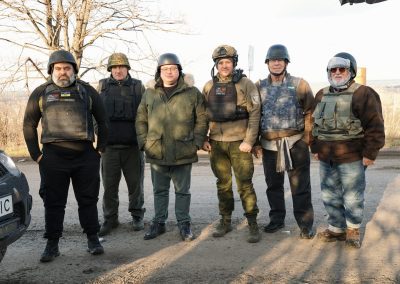 Dressed for the war zone frontline and cold weather, Pastor Oleg Gricyk, Russell Kyzar, and Bob Gilmore meet soldiers and medics.