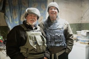 Bob Gilmore (left) and Russell Kyzar (right), pictured in a bunker, the basement of a bombed-out apartment complex, where they visited Ukrainian soldiers. The team visited villages along and between the frontlines of the war. The men have made two trips to Ukraine, working with local pastors to share supplies, encouragement and the gospel. 