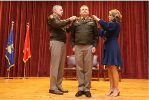Maj. Gen. Janson D. Boyles (left), the Adjutant General of Mississippi, and Vicki Ginn (right), wife of Col. Bobby Ginn, both pin the rank of brigadier general on Col. Bobby M. Ginn, Jr., during his promotion ceremony at Camp Shelby Joint Forces Training Center, Hattiesburg, MS, on Thursday, April 25, 2024.