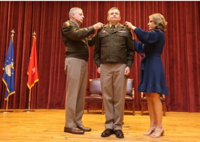 Maj. Gen. Janson D. Boyles (left), the Adjutant General of Mississippi, and Vicki Ginn (right), wife of Col. Bobby Ginn, both pin the rank of brigadier general on Col. Bobby M. Ginn, Jr., during his promotion ceremony at Camp Shelby Joint Forces Training Center, Hattiesburg, MS, on Thursday, April 25, 2024.