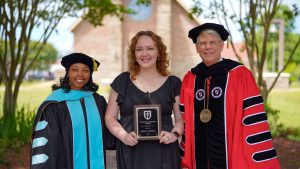 Kathryn Grace Albritton, recipient of WCU's 2024 Student Leadership Award, is shown at Honors Day with Dr. Valerie Bridgeforth, WCU vice president for student affairs, and WCU President Dr. Ben Burnett.