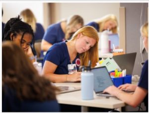 Avery Wolf is among UMMC nursing students taking notes during the first day of traditional BSN classes in Oxford.