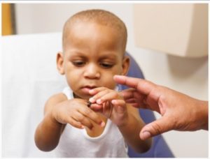 Kobe looks at his new thumb for the first time.
