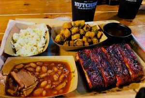 Delicious ribs, cole slaw, fried oka and barbecue beans at Hutchins BBQ in Frisco, Texas. 