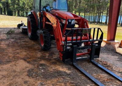 Kubota tractor with front end loader and pallet forks