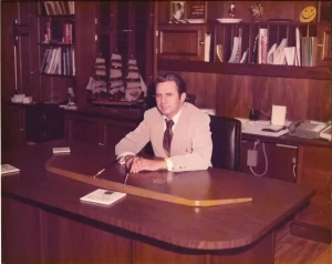 Leslie B. Lampton, Sr. seated at his desk (Courtesy of Ergon)