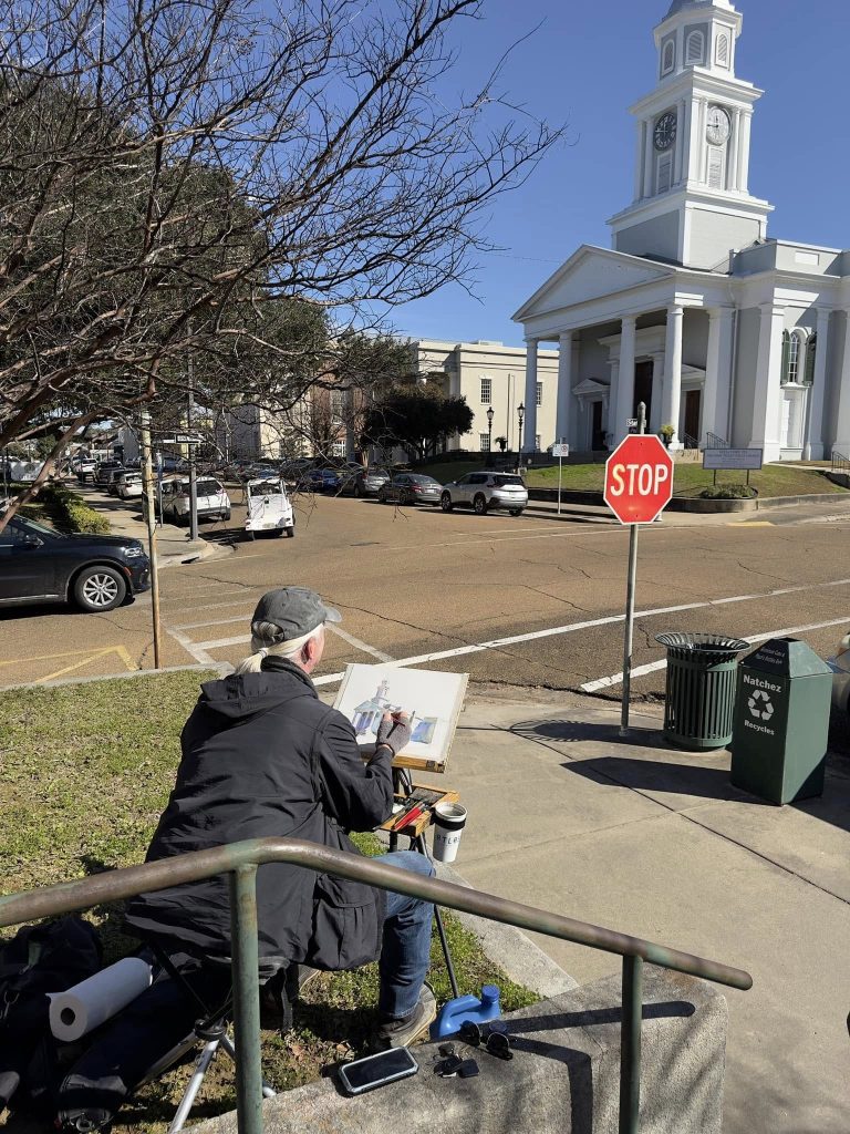 Waters in Downtown Natchez on January16, 2024, at the corner of State and Pearl Streets, while painting the First Presbyterian Church of Natchez. (Photo by Paul Peterson.)