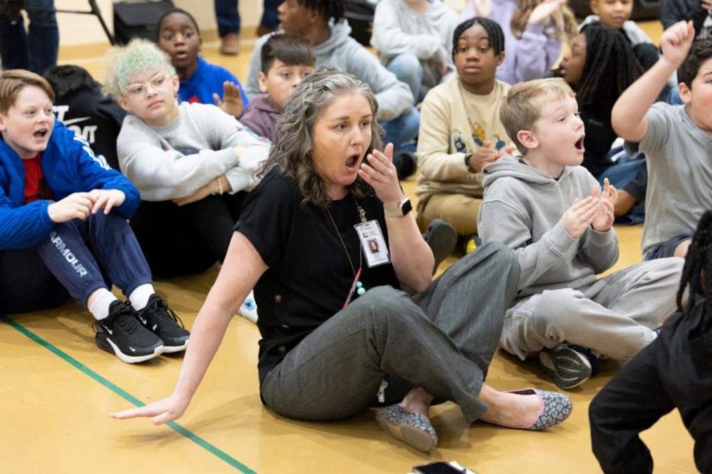 Fifth grade ELA, science, and social studies teacher Amanda Duplessy is completely stunned to learn that she is the recipient of a $25,000 Milken Educator Award. Photo credit: Milken Family Foundation