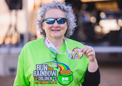 Ellen Hansen, Children's of Mississippi chief operations officer and chief nursing officer, shows her medal for walking the 5K route.