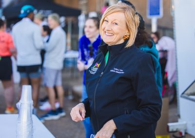 Louise Dove, Department of Pediatrics business development manager, smiles while volunteering Sunday.