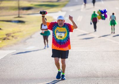 Chuck McDonald of Jackson cheers from the 10K course.