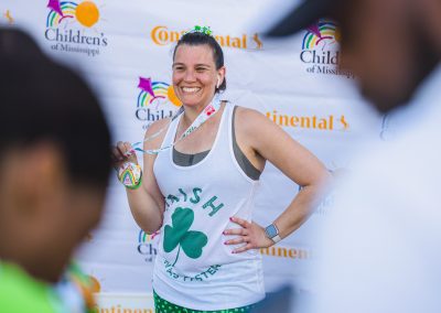 Nina Cole of Jackson smiles after earning her 10K medal.