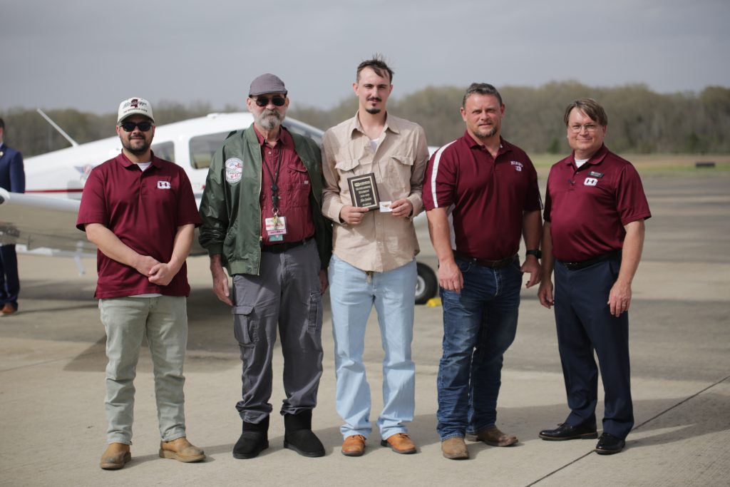 Hinds Aviation Student of the Year Alan Sanders, center, was honored as part of the airplane celebration. He is with Aviation instructors, from left, Clyde Davis, WP Marsh, Bryan Spurlock and Director of Aviation Brett Oleis.