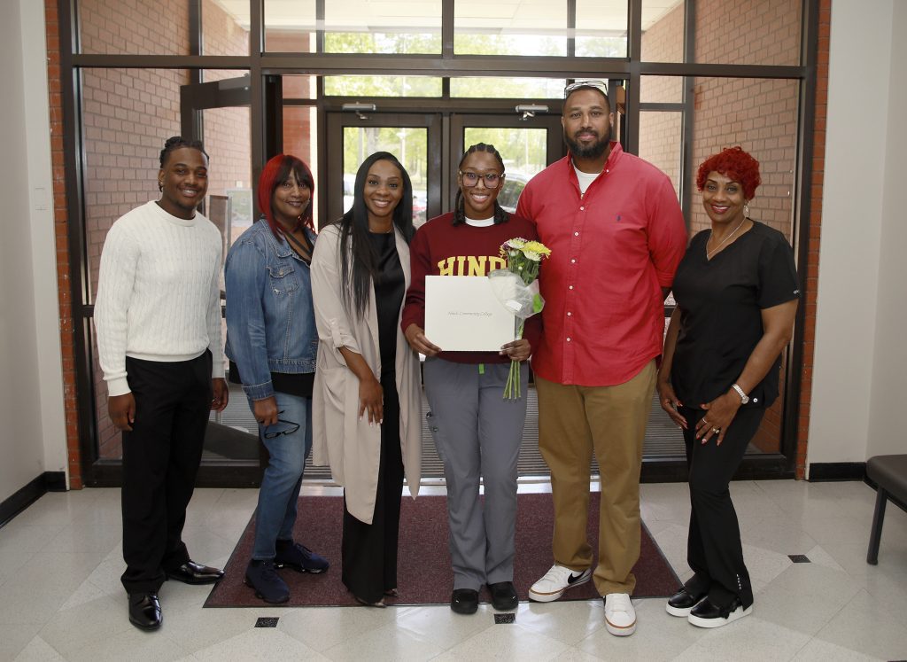 N’Kyah Kendrick of Jackson, center, was awarded the annual Carla McCulloch Scholarship given to a second semester Associate Degree Nursing Student at Hinds Community College each year. She is with friends and family including, from left, Marquis Thigpen, grandmother Robbin Simmons, mom Shamalitea McGee, dad Darrell Kendrick and grandmother Bonita McGee.