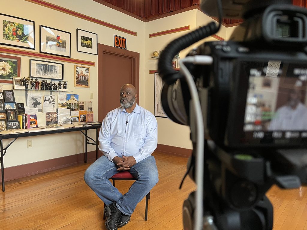 Terry Minor of Detroit, Michigan, is a member of the Toles family. He is being interviewed by Marlos Evan and Vesna Pavlović from the Woven Wind team for the "Toles Family: Coming Home" film. The interview took place in 2021 at the Natchez Museum of African American History and Culture.