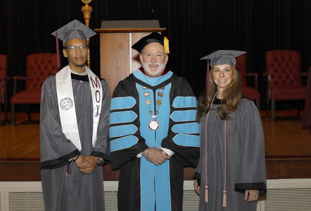 Jaden McKinnis, 19, of Magee, left, said the invocation and benediction at the May 14 graduation ceremony at Hinds Community College. Adonia Georgette Turner of Clinton, right, was the student speaker. They are with Hinds President Dr. Stephen Vacik.