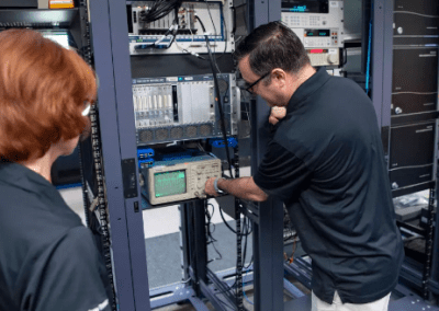 Members of the NASA Data Acquisition System team at NASA’s Stennis Space Center evaluate system hardware for use in monitoring and collecting propulsion test data at the site. Photo Credit: NASA/Danny Nowlin)
