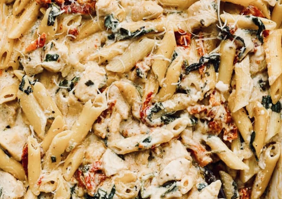 This delicious, easy-to-make dish filled with chicken, pasta, tomatoes, spinach and cheese is the perfect make-ahead dish to throw in the cooler and take to the beach for reheating for a quick meal.