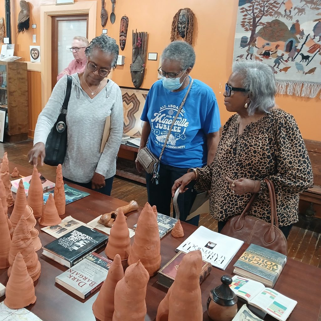 The Natchez Museum of African American History and Culture recently hosted the Cypress Knees exhibit presented by Woven Wind. Viewers of the exhibit’s clay sculptures included, from left, Debbie Toles, Sue Harris, and Ruthie Smith.