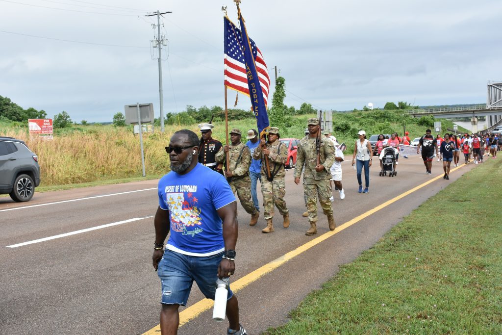 Hundreds of people participated in the 2025 Miss-Lou Memorial Day Parade. Here they are crossing the Natchez-Vidalia Bridge from Vidalia as they proceed on to the Natchez National Cemetery for a ceremony to honor the fallen U.S. military service members. Photo by Albert L. Jones