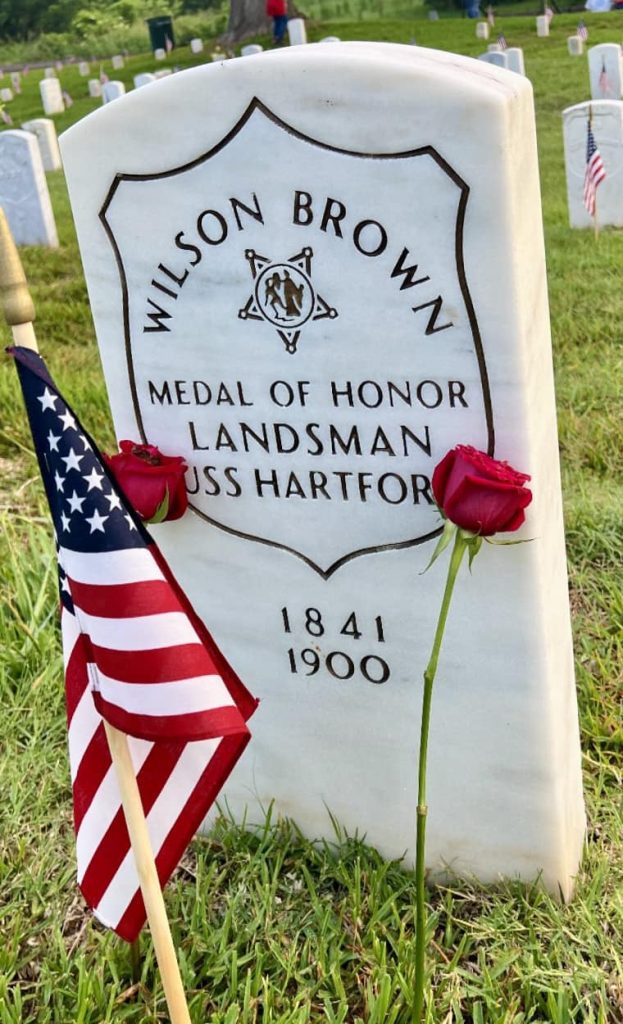Each year, Karla Brown and her volunteers honor Wilson Brown with two flowers. Brown is the only Medal of Honor recipient buried at Natchez National Cemetery. Flags are placed on the graves by the Natchez National Cemetery staff and volunteers. (Photo courtesy of Karla Brown)
