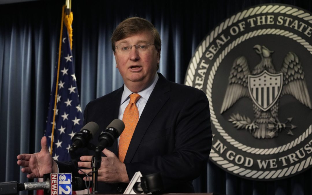 Mississippi Republican Gov. Tate Reeves answers a reporter's question on his announcement of a tech company expected to invest $10 billion to build two data processing centers that will create 1,000 jobs in central Mississippi, during a Wednesday, Jan. 24, 2024, news conference in Jackson, Miss. (AP Photo/Rogelio V. Solis)
