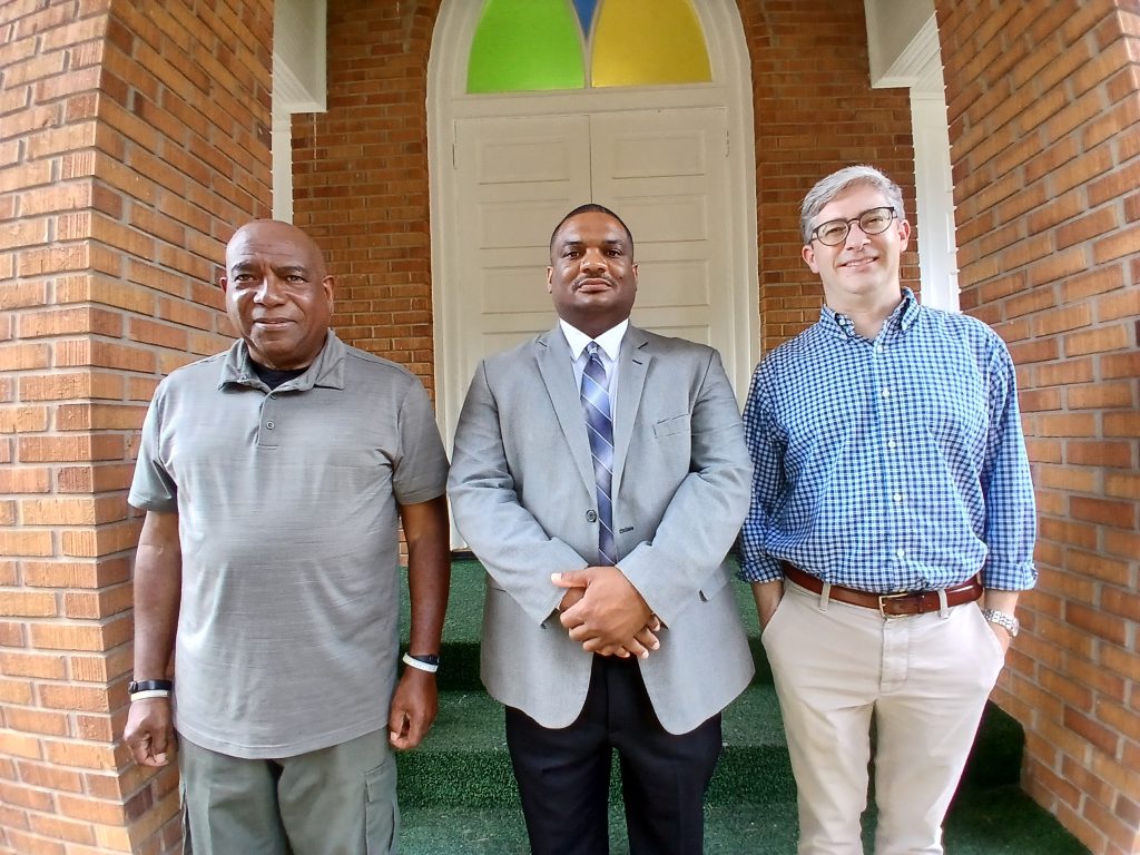 Members of Beulah Missionary Baptist Church are celebrating the restoration of their church steeple and exterior windows completed in May. Pictured in front of the church, from left, are Robert Morgan, deacon; Johnathan T. Hargrave, pastor; and Carter Burns, executive director of the Historic Natchez Foundation.