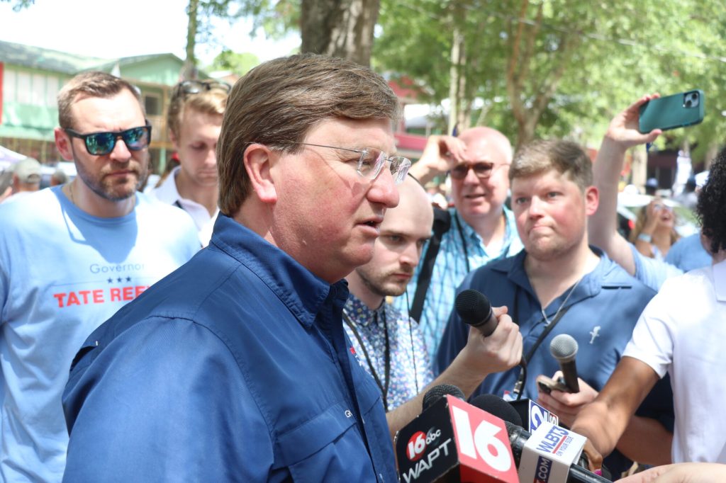 Gov. Tate Reeves addresses members of the press after speaking at the Neshoba County Fair Thursday morning, 2024. (Photo by Jeremy Pittari | Magnolia Tribune)