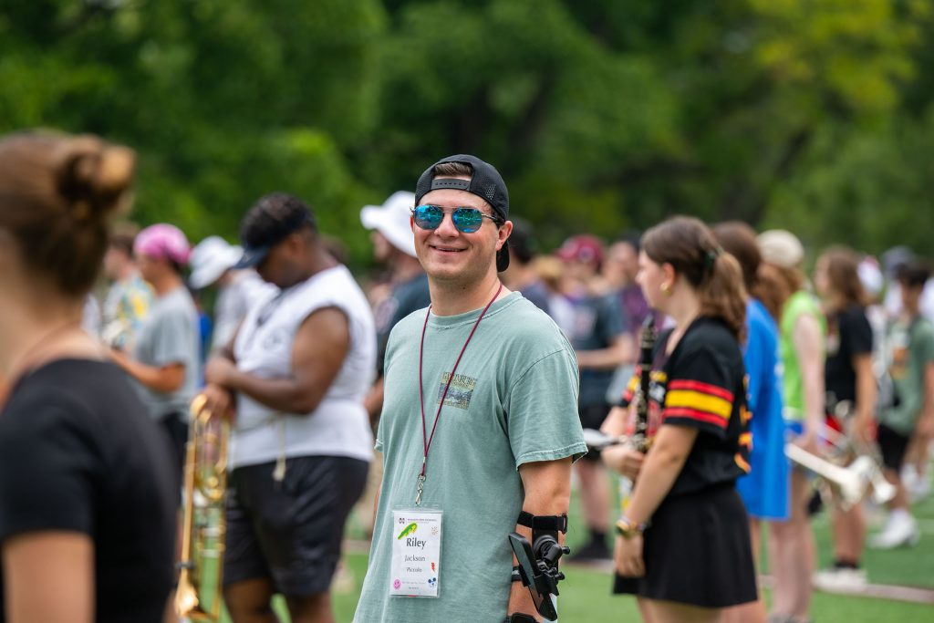 Riley Jackson of Collierville, Tennessee, smiles during a practice session for the Famous Maroon Band. Jackson, who plays the piccolo, is a chemical engineering major, one of more than 160 Bagley College students in the FMB. (Photo by Emily Grace McCall)
