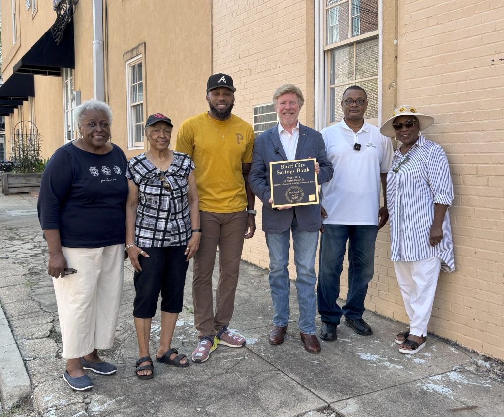 Mayor Dan Gibson recently presented a historical marker to Eric Berry that honors the legacy of the Bluff City Savings Bank, Natchez’s only Black-owned bank. From left are Dora Hawkins, Jacqulyn Williams, Berry, Gibson, Dr. Roscoe Barnes III, and Thelma Newsome.