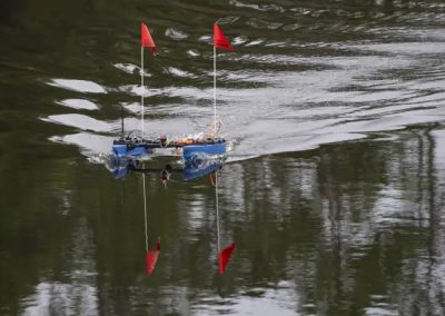 US Naval Research Laboratory personnel conduct tests on The Blue Boat made by Blue Robotics, an unmanned surface vessel, at NOAA's National Data Buoy Center basin at NASA Stennis on Dec. 19, 2024. (Photos by NASA/Danny Nowlin)