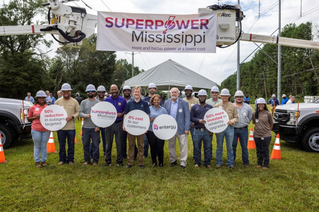 Entergy MS CEO Haely Fisackerly pictured with PSC Commissioners De'Keither Stamps and Wayne Carr as well as Entergy linemen and staff (Photo from Entergy Mississippi on Facebook)