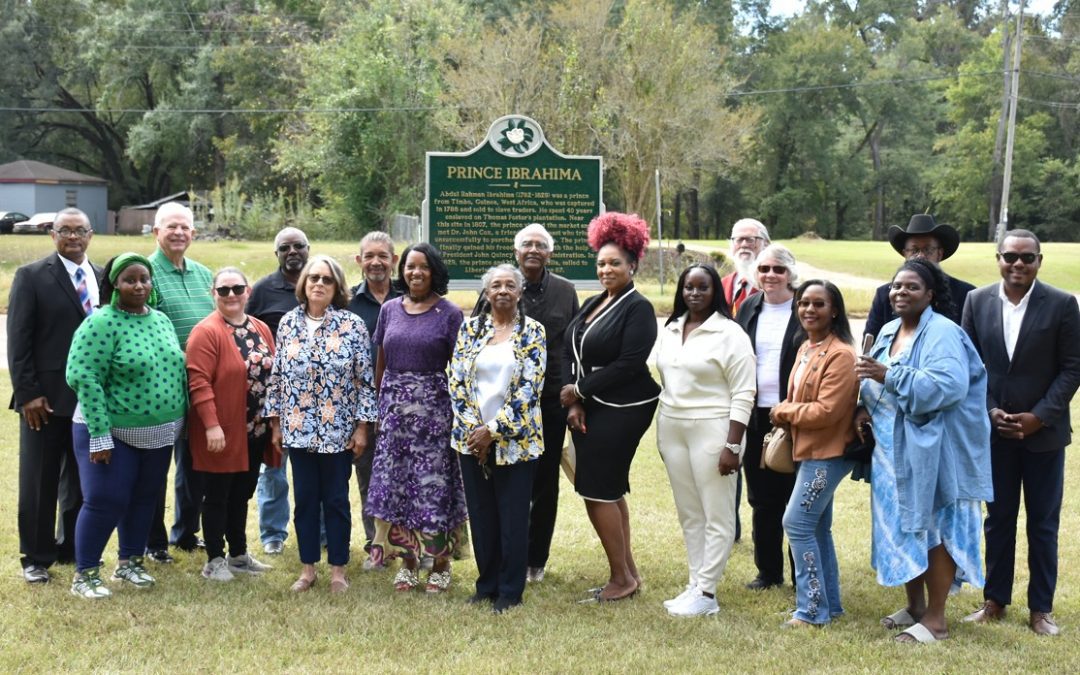 Descendants of Prince Ibrahima and Dr. John Coates Cox join members of the Natchez Historical Society for a photo in front of Ibrahima’s marker. Photo by Albert L. Jones