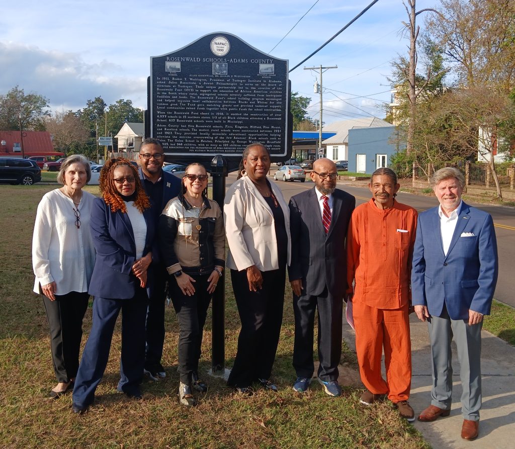A marker honoring Julius Rosenwald and Booker T. Washington for their support of Black schools in Adams County and the American South was recently unveiled in a special ceremony. The marker is posted in front of the administrative office of the Natchez-Adams County School District on Homochitto Street. Pictured from left are Dr. Cecile Dianne Bunch, Dr. Brenda Robison, Tony Fields, LLJuna Grennell Weir, Superintendent Zandra McDonald, Phillip West, Bobby Dennis, and Mayor Dan Gibson. (Photo credit: Albert L. Jones)