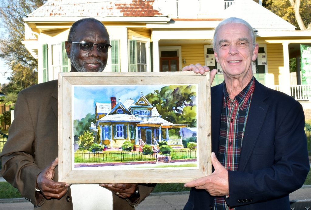 Wyatt Waters, right, presents a giclée print of his watercolor of the Dr. John Bowman Banks Museum to the Rev. LeRoy White, pastor of Rose Hill Missionary Baptist Church, which owns and operates the museum. Photo by Albert L. Jones